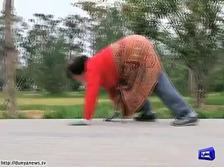 Chinese fitness fanatics CRAWL on their hands and feet for morning exercise .