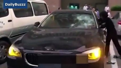 Woman cheated by husband ruins £200,000 BMW with a hammer