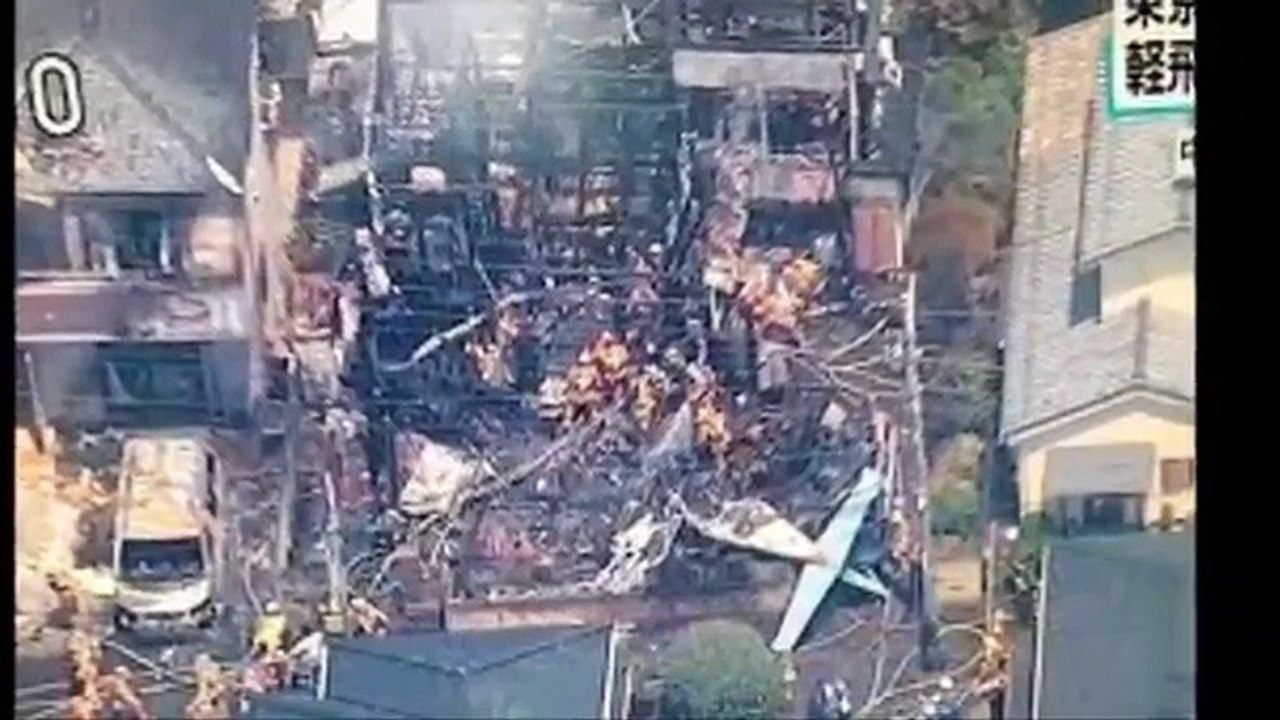 Light plane crashes into Tokyo residential area, sets fire to houses