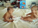 Twin baby boys have a conversation