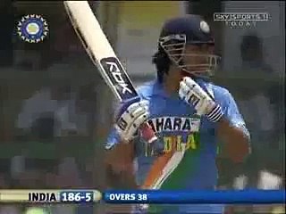 Dhoni plays with ice bags on his back,Jamsedpur 2006. -