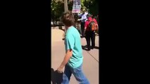 Crazy atheist Guy attacks Christian speaker in public!