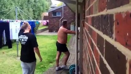 Angry Dad Having Trouble With The Sprinkler
