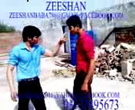 two guys are fighting each other on college roof .explicit content