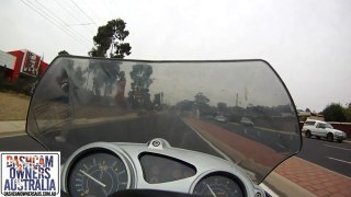 Car pulls across Motorcycle rider causing crash.