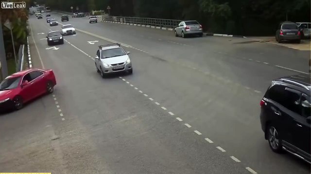 LiveLeak - Biker Slams into Turning Car and Almost Flips It !