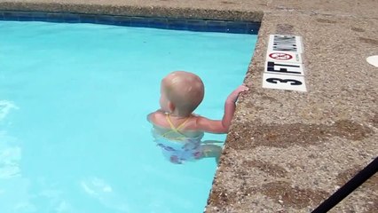 Toddler swims solo in the pool