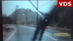 Driver shows quick thinking as he spots oncoming floods and puts car into reverse to escape danger