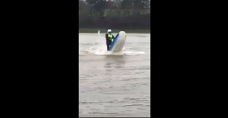 Beat the floods with a jet ski: Daredevil takes to the water to beat bad weather