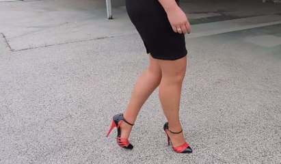 I show you the red and black fashionable high heel sandals outdoor
