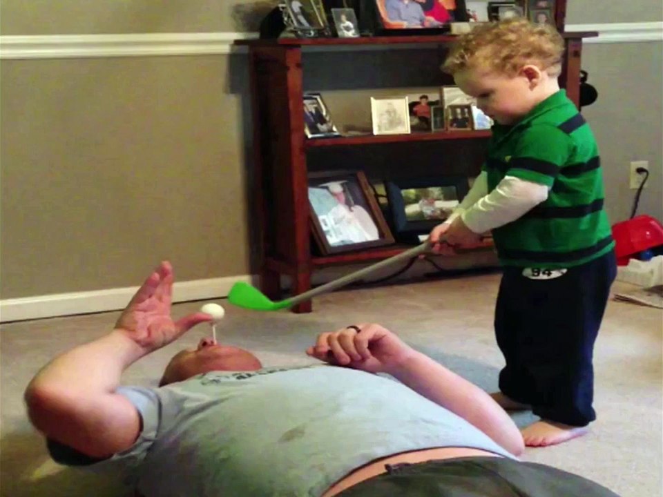 Kid Fails To Hit Golf Ball Out Dad's Mouth