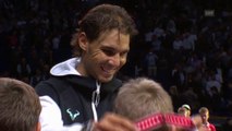 Rafa Nadal and Roger Federer handed medals to ballkids in Basel.
