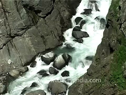 Waterfall gushing down the mountain in the Indian Himalayas, Jammu and Kashmir!