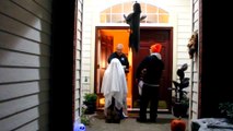 Adult Man on his knees trick-or-treat as a kid Ghost Haha