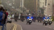 Funeral procession passes throguh streets of Merseyside