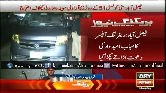 Returning Officer celebrating a candidate's win in LB polls