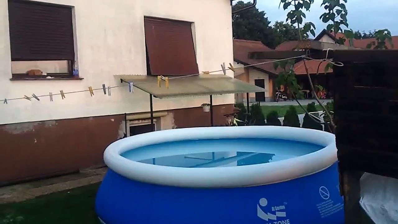 Crazy Guy Jumps Off Roof Into Small Pool