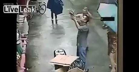 Man on the street catches a baby as it falls from a fifth-story window