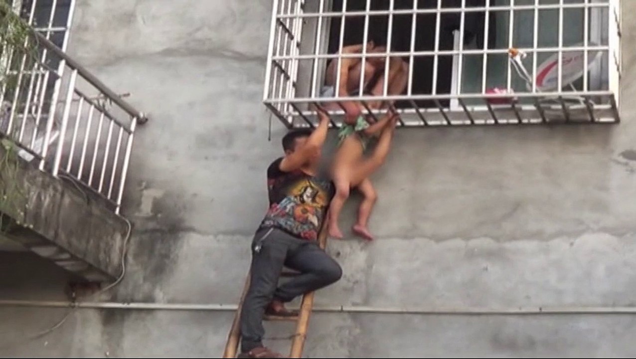 Toddler falls through window bars... rescued by firefighters