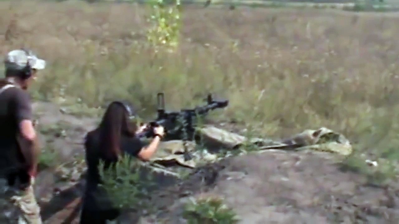 Ukrainian military woman firing DSHK Heavy Machine Gun