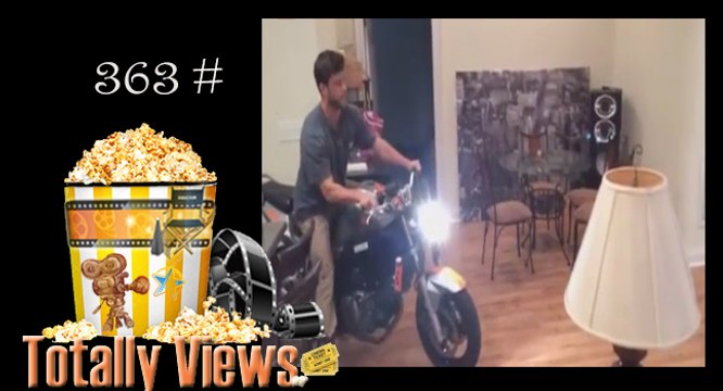Guy tries to do a wheelie in his living room