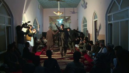 Wedding revellers in Afghan village celebrate Taliban rout