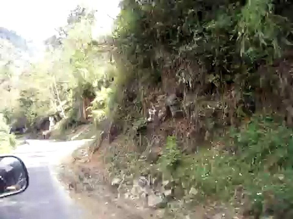 Bhutan, driving by waterfall