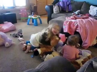 Girls wrestling in animal pile