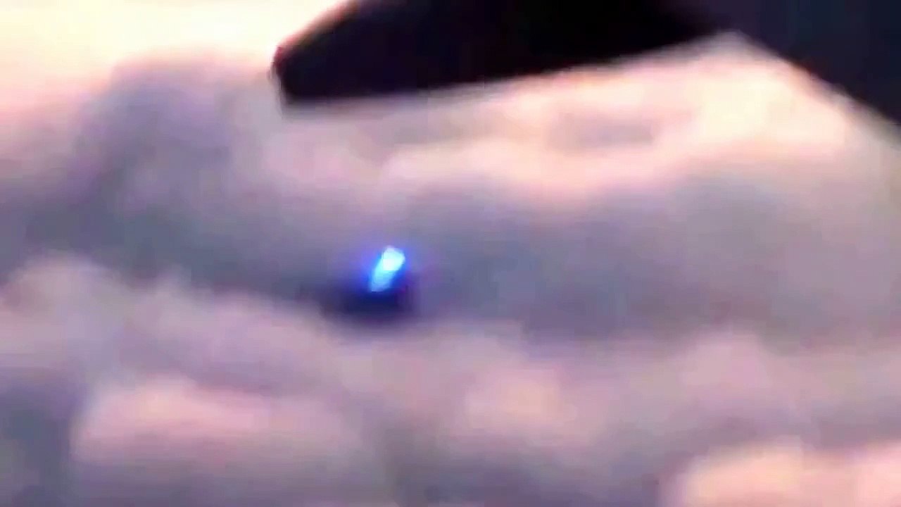 UFO FLYING BEHIND THE PLANE!