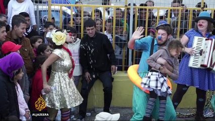 Clowns give refugees a chance to smile in Greece