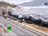 New dramatic video: Tsunami wave spills over seawall, smashes boats, cars