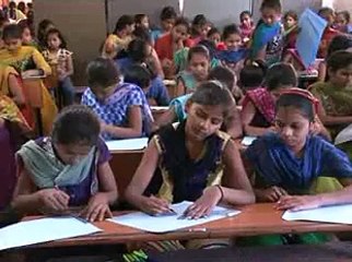 Narmada Collector at election based poster making competition by students