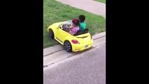 Little boy teaching a little girl how to ride a car
