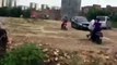 [RAW] Car Trying To Run Over Police Officers Gets Stopped By Excavator, China