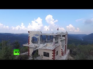 Tải video: Drone flyby: Syrian mountain village just liberated from jihadists