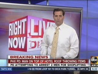 PD: Man throwing items at police on motel roof