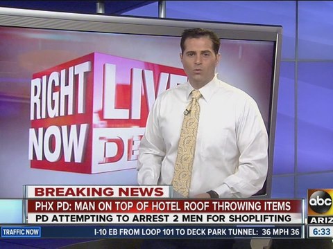 PD: Man throwing items at police on motel roof