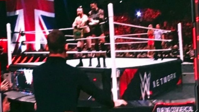 Wayne Rooney slaps WWE Superstar Wade Barrett in the face during Monday Night Raw in Manchester