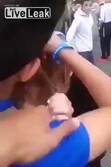 German girl holds "Free Hugs" sign to welcome immigrants