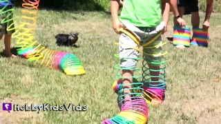 GIANT Slinky SWIMMING! Pool Slide Waterfall Cut Scenes of Worlds Biggest Egg HobbyKidsVids