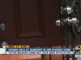 Woman held at gunpoint in Phoenix home