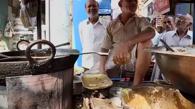 Man Fries Food With Bare Hands