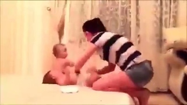 Parents Handling Kids Changing Clothes Stopping Running Moving Children 2015