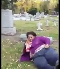 Overweight mourner cant get up from cemetery floor after falling over