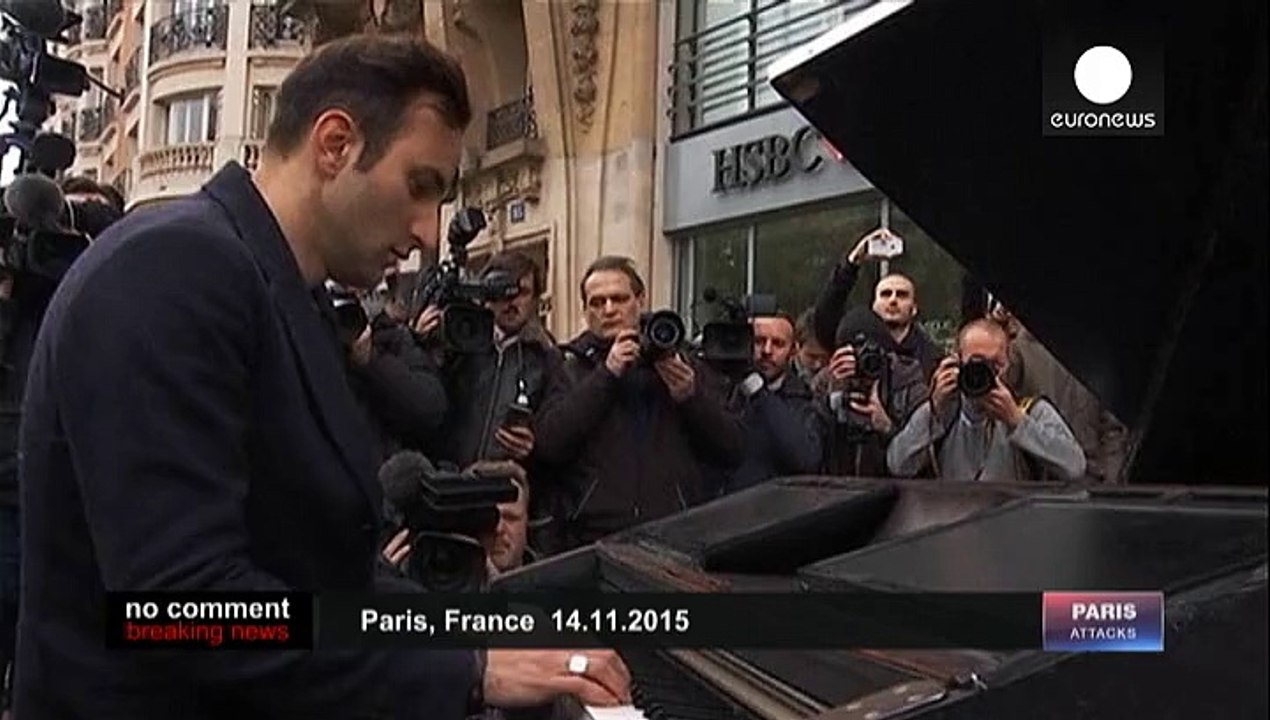 Imagine... street musician honour Paris dead