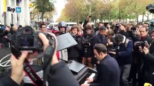 man plays immagine by john lennon at piano near bataclan at at paris attack
