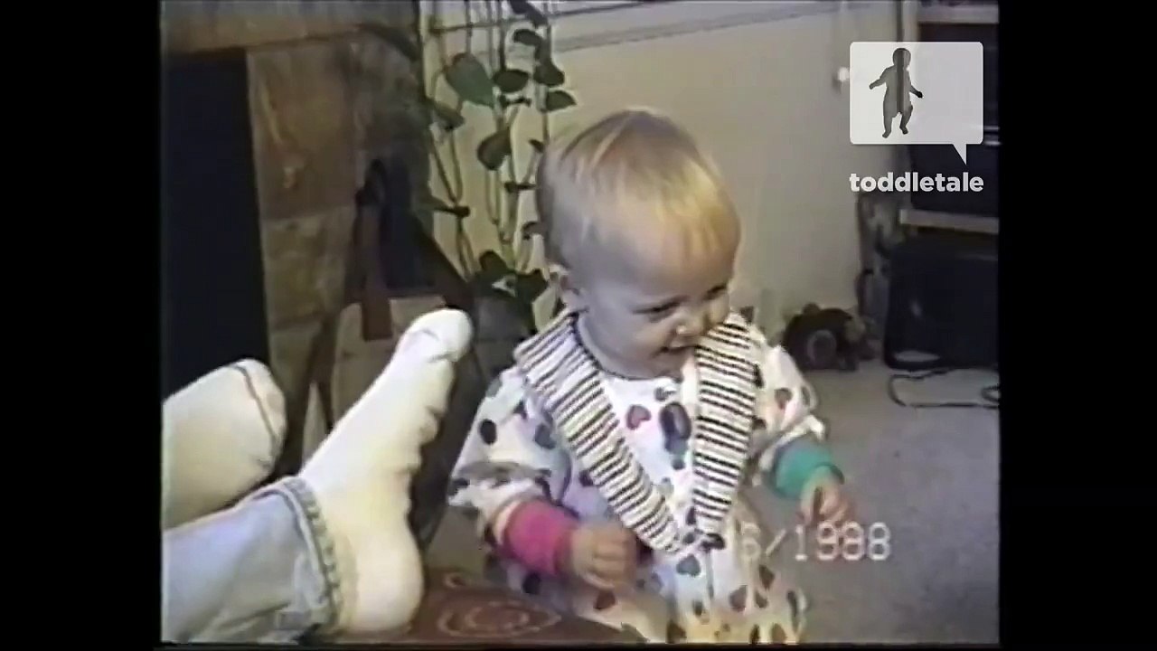 Baby girl cringes after smelling her dads socks