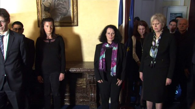 Theresa May observes minute of silence for Paris victims