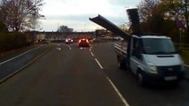 Steel Beams Fall Off Truck Into Oncoming Traffic