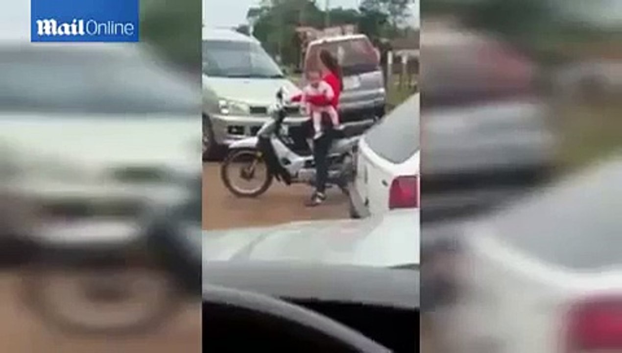 Mother Falls off Her Motorbike While Carrying her BABY!